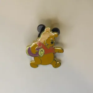 Disney Winnie the Pooh carrying purple object Pin