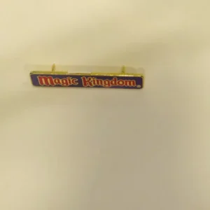 Disney Magic Kingdom Purple Rectangle Red Text Logo Pin